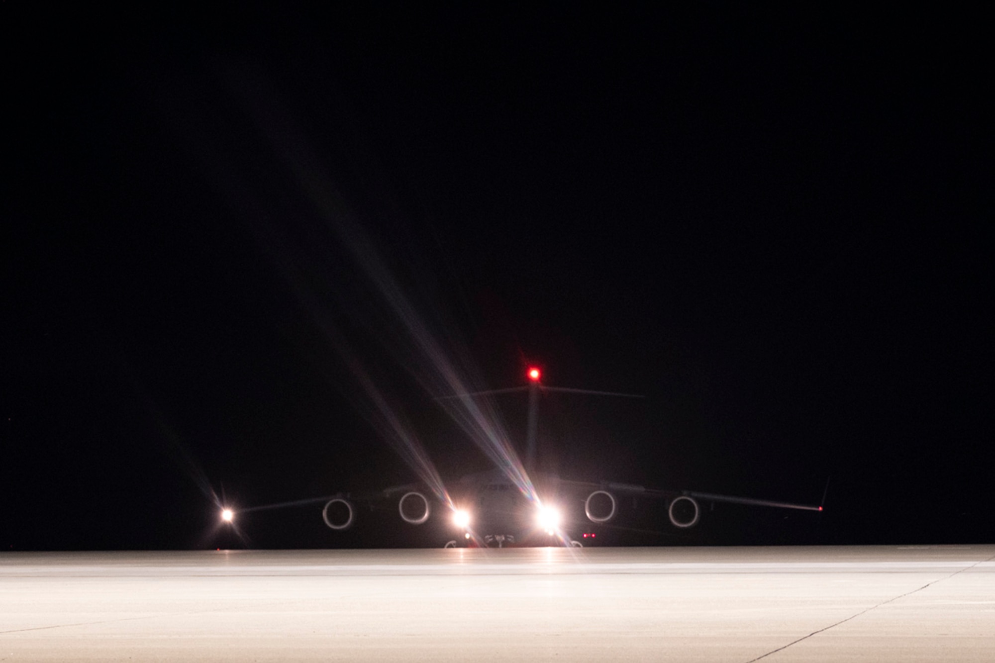 Plane taxis on a flightline