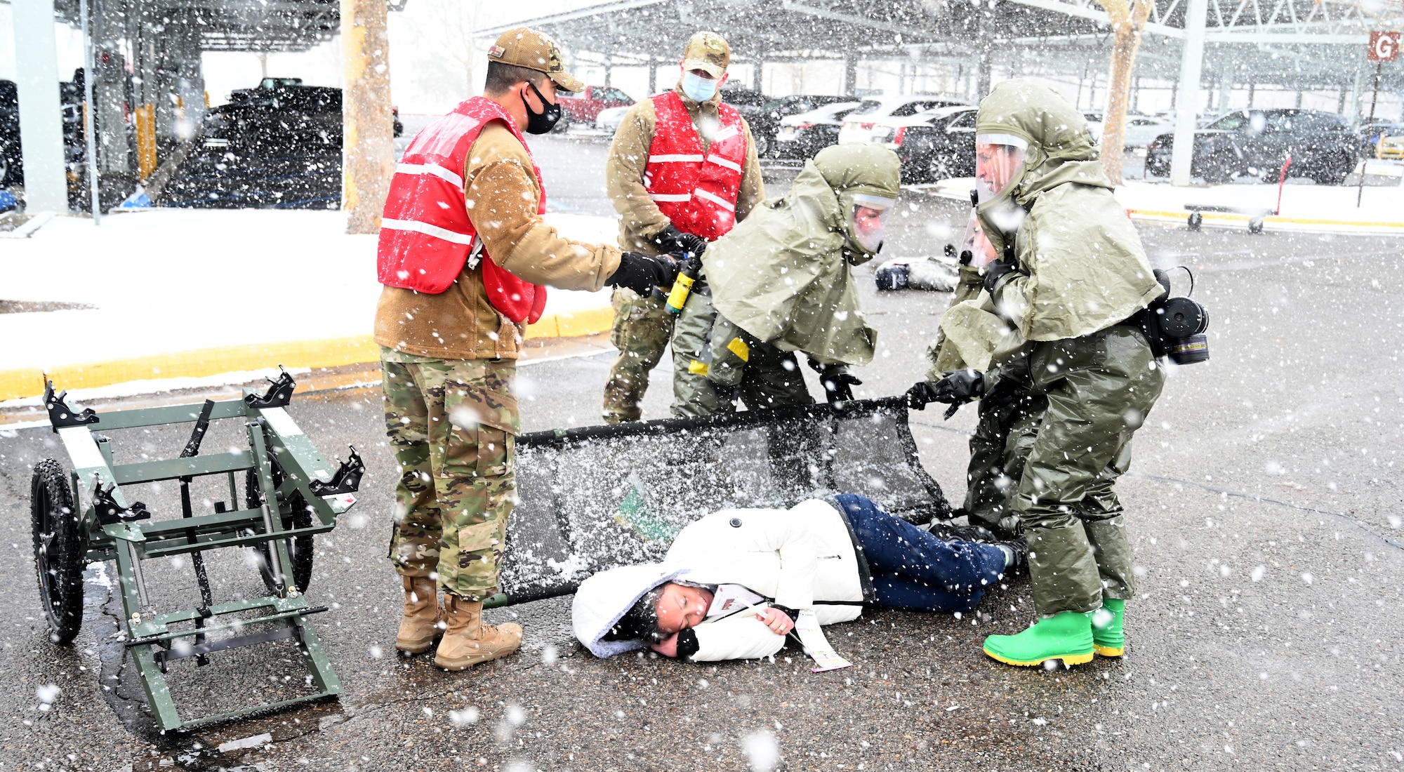 Medics lifts casualty onto litter