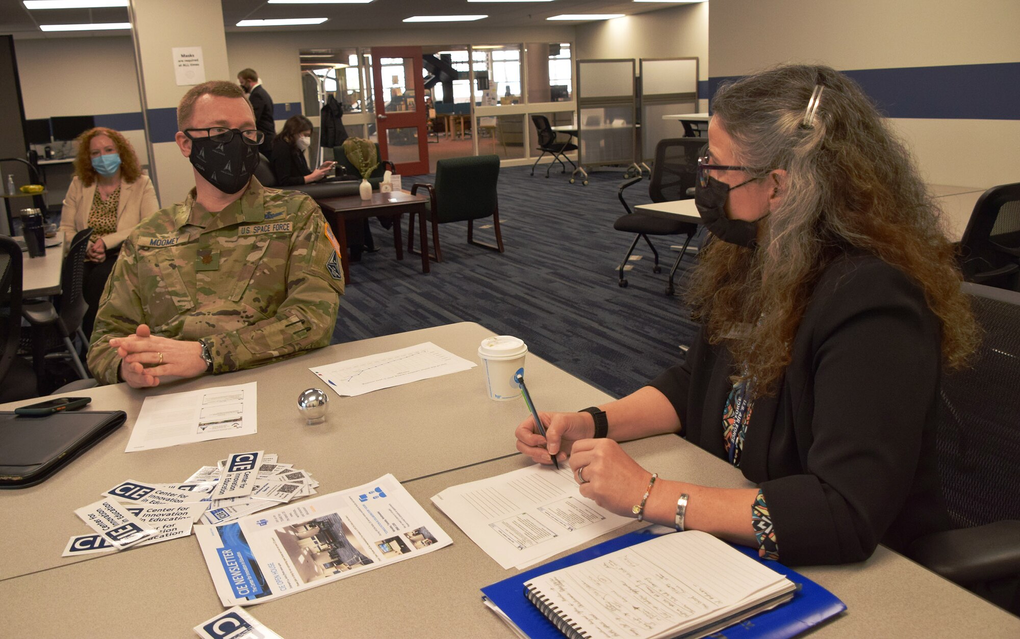 Dr Walsh visits with AFIT personnel.