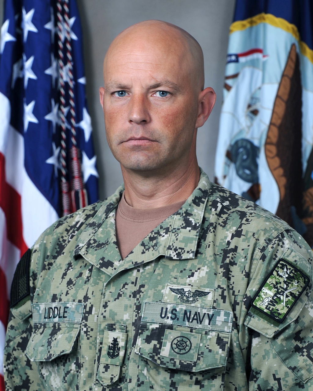 Aviation Electronics Technician Senior Chief Petty Officer William R. Liddle, Senior Enlister Advisor, Expeditionary Warfare Training Group, Atlantic (EWTGLANT) poses for an official studio portrait. (U.S. Marine Corps