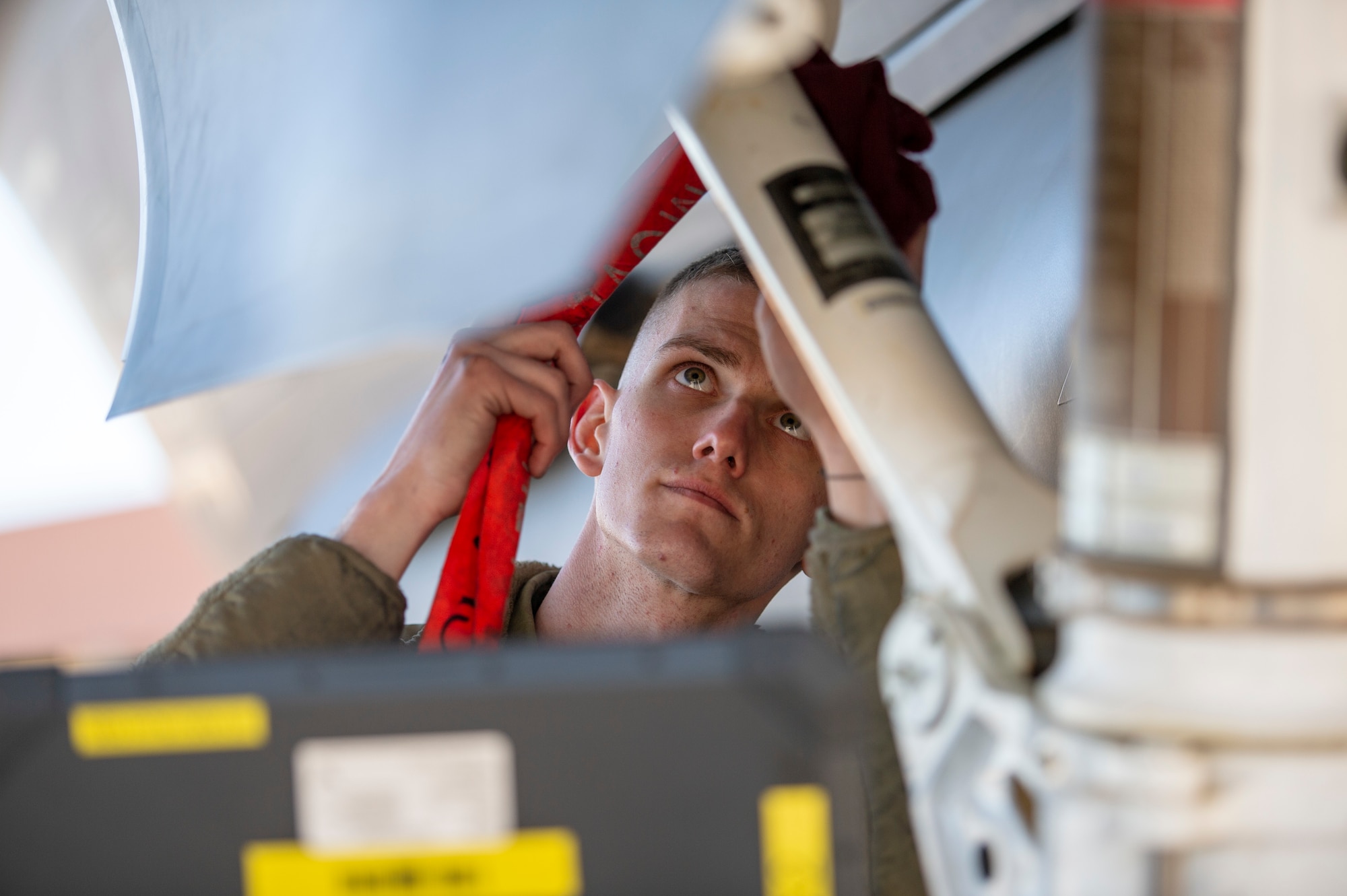 U.S. Air Force Senior Airman Aaron Robosky, 61st Aircraft Maintenance Unit F-35A Lightning II assistant dedicated crew chief, performs an F-35 inspection with the help of a wireless capable ruggedized laptop Feb. 3, 2022, at Luke Air Force Base, Arizona. The ability to communicate wirelessly with maintenance operation systems while on the ramp has improved Airmen’s ability to streamline daily operations while supporting combat-ready Airmen. (U.S. Air Force photo by Staff Sgt. Collette Brooks)