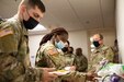 Soldiers line up for potluck luncheon