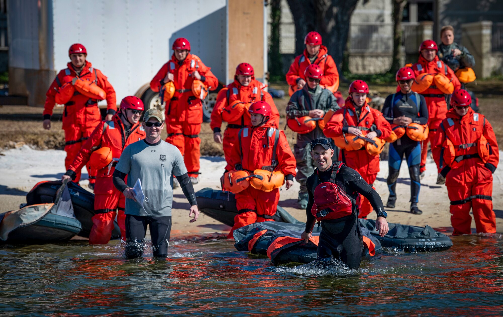 Survival, Evasion, Resistance and Escape specialists lead Water Survival Training participants into the Sound Feb. 15, 2022, at Hurlburt Field, Florida.