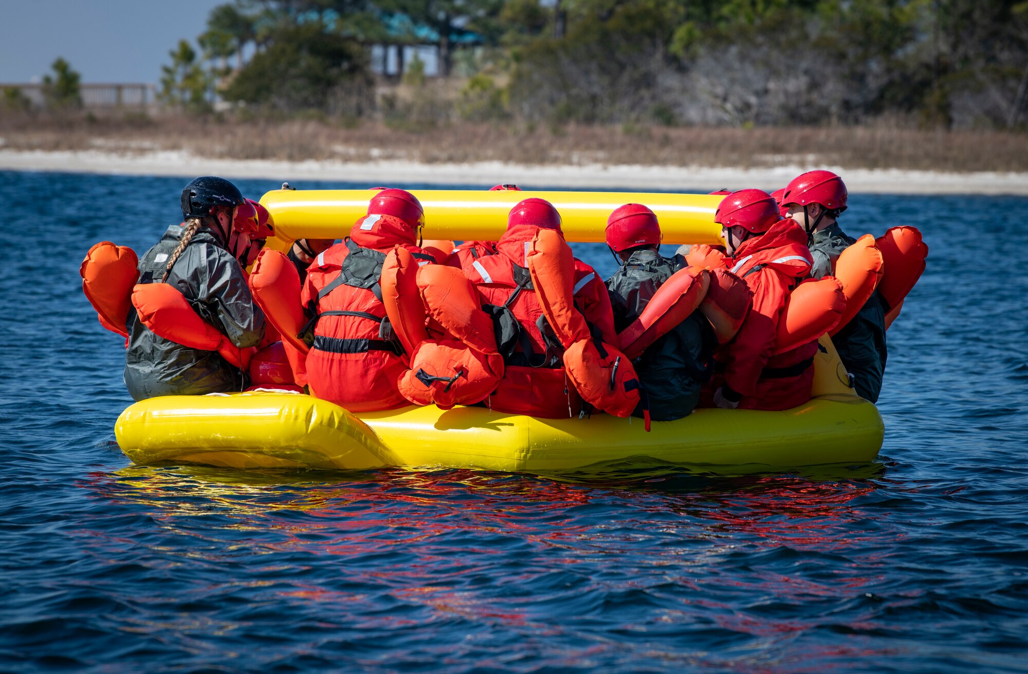 Water Survival Training participants board a life raft Feb. 15, 2022, at Hurlburt Field, Florida