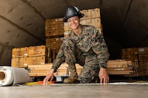 U.S. Marine Corps Sgt. Alayna N. Krontz, an ammunition technician with Ammunition Company, 2nd Supply Battalion, 2nd Marine Logistics Group, poses for a photo at the Ammunition Supply Point on Camp Lejeune, North Carolina, Feb. 23, 2022. "Be the best you can. Be the best at whatever you do in life. If you have the worst job, still do your best. Someone will see your hard work and effort and it will pay off," Krontz said regarding her award. Krontz recently won the 2021 U.S. Marine Corps Ammunition Noncommissioned Officer of the Year Award. (U.S. Marine Corps photo by Sgt. Adaezia Chavez)