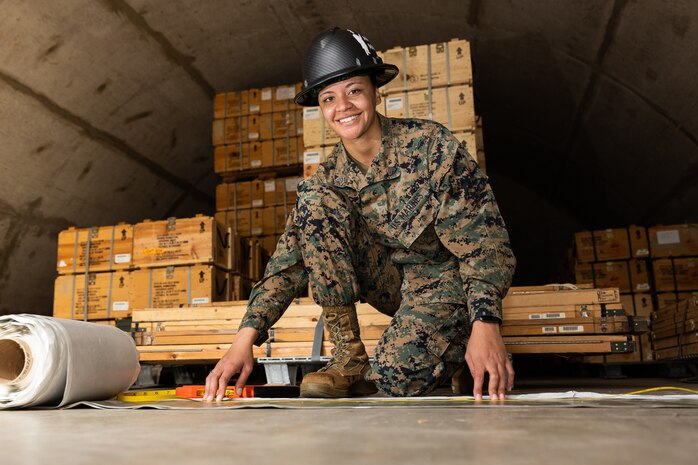 U.S. Marine Corps Sgt. Alayna N. Krontz, an ammunition technician with Ammunition Company, 2nd Supply Battalion, 2nd Marine Logistics Group, poses for a photo at the Ammunition Supply Point on Camp Lejeune, North Carolina, Feb. 23, 2022. "Be the best you can. Be the best at whatever you do in life. If you have the worst job, still do your best. Someone will see your hard work and effort and it will pay off," Krontz said regarding her award. Krontz recently won the 2021 U.S. Marine Corps Ammunition Noncommissioned Officer of the Year Award. (U.S. Marine Corps photo by Sgt. Adaezia Chavez)