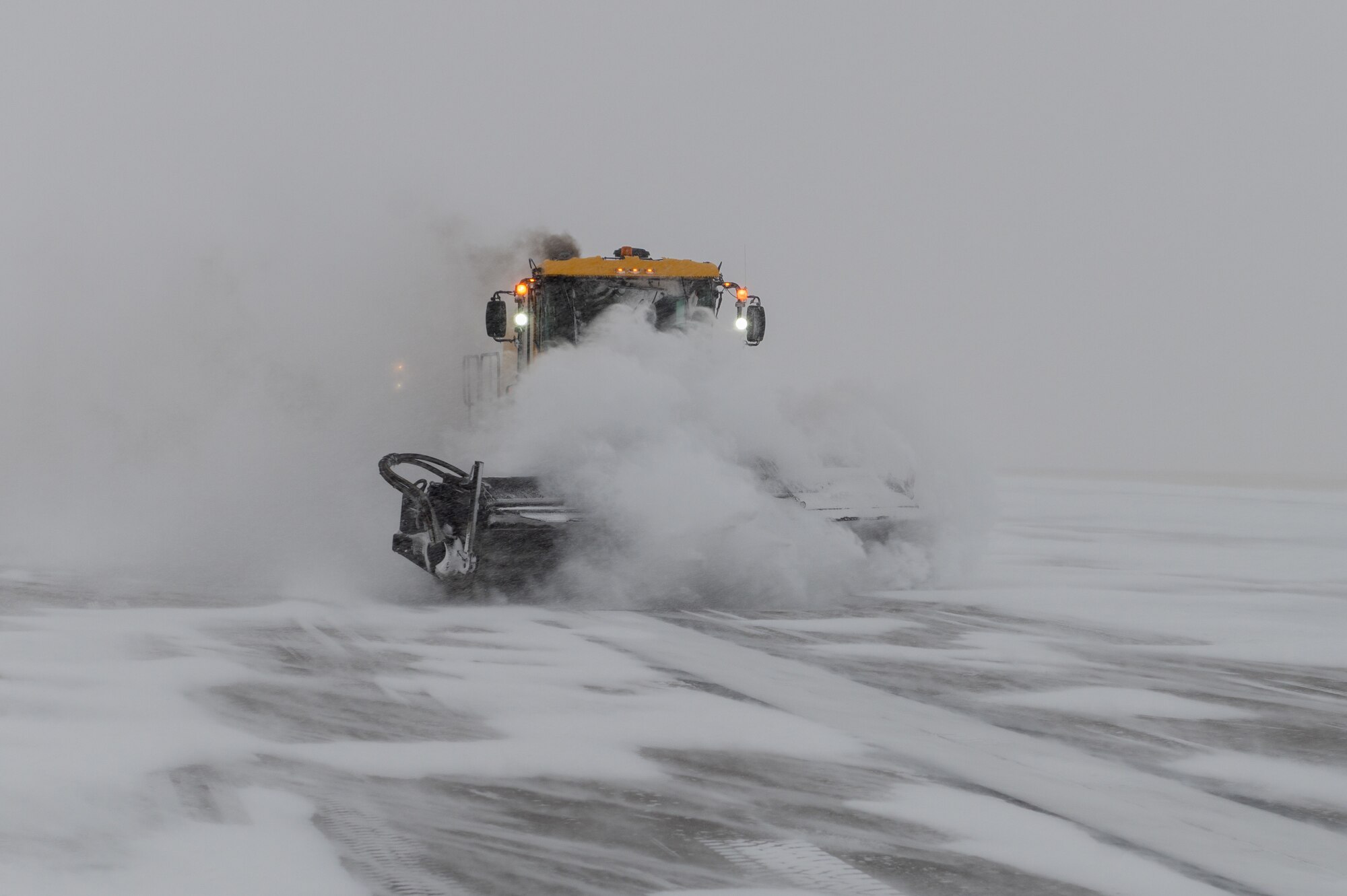 The 22nd Civil Engineering Squadron’s snow removal team plow the flight line Feb. 17, 2022, at McConnell Air Force Base, Kansas.