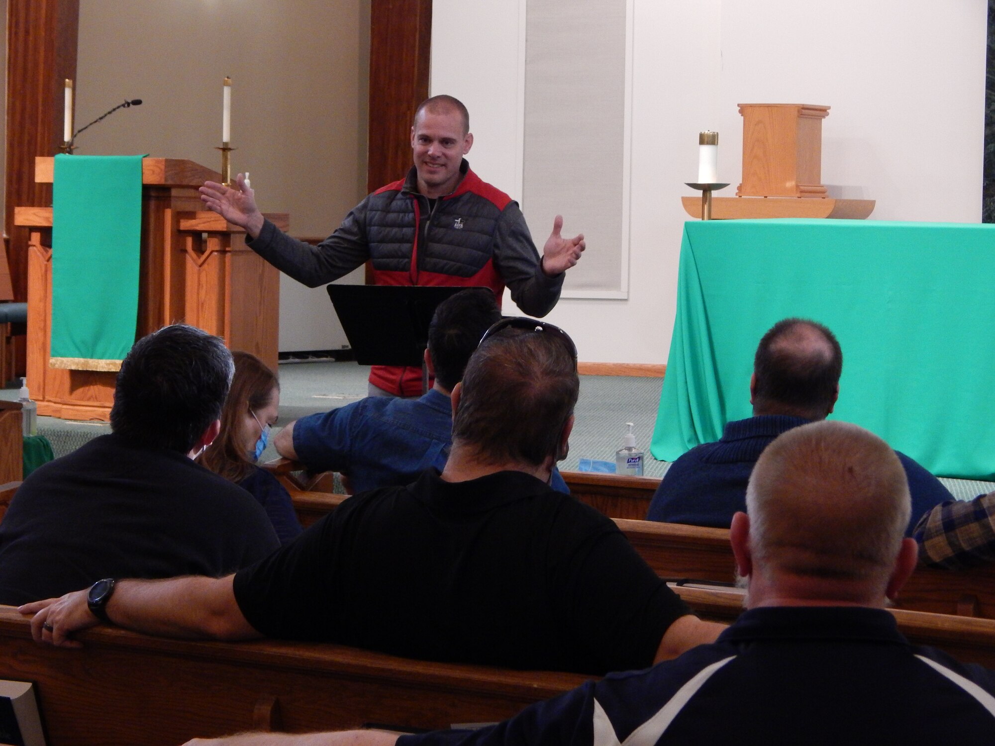 man speaks to group