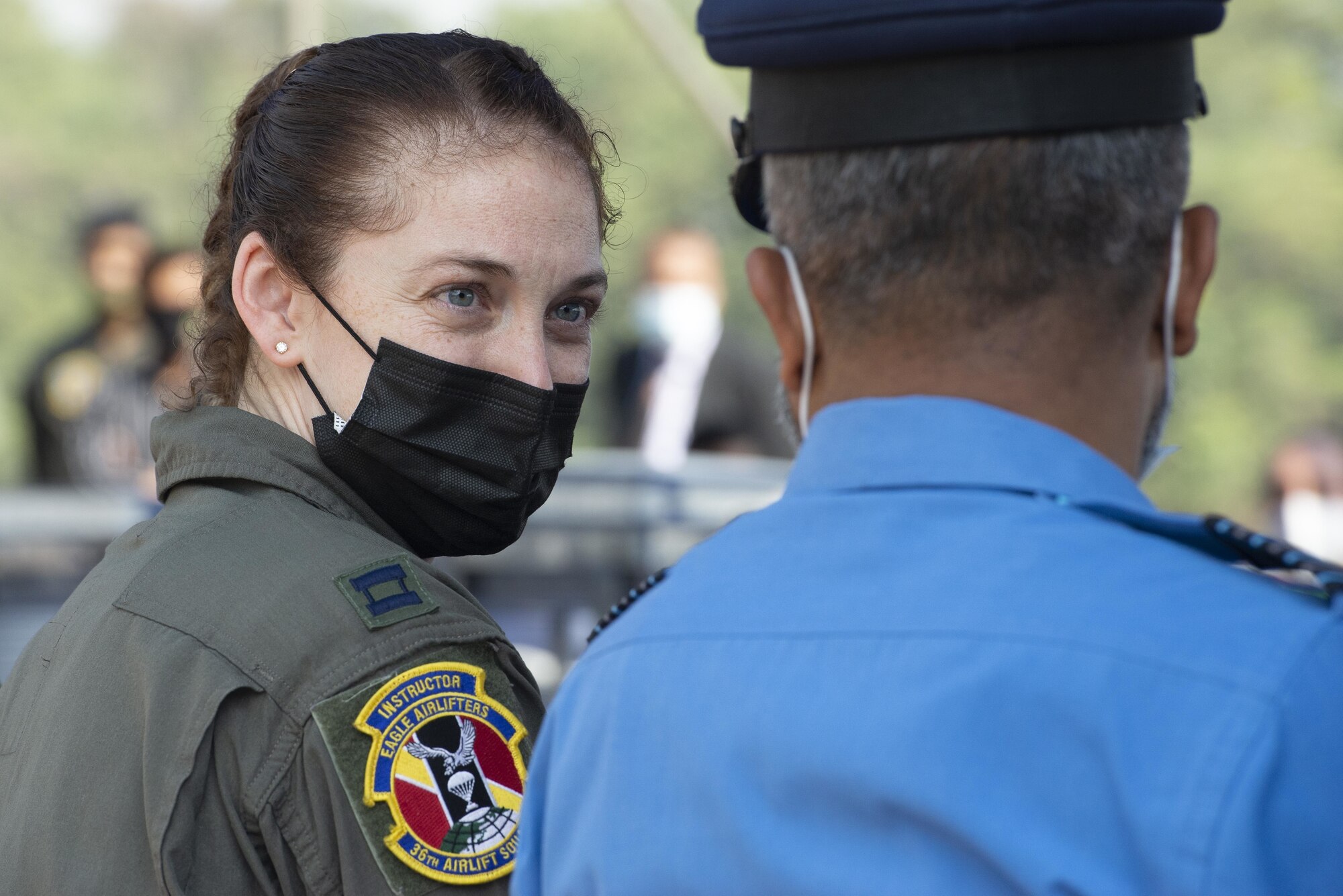 .S. Air Force Capt. Madeline Atkinson, 36th Expeditionary Airlift Squadron Mission Commander, speaks with a Bangladesh Air Force (BAF) officer during the Exercise Cope South 2022 opening ceremony Feb. 19, 2022, at BAF Base Bangabandhu, Bangladesh.