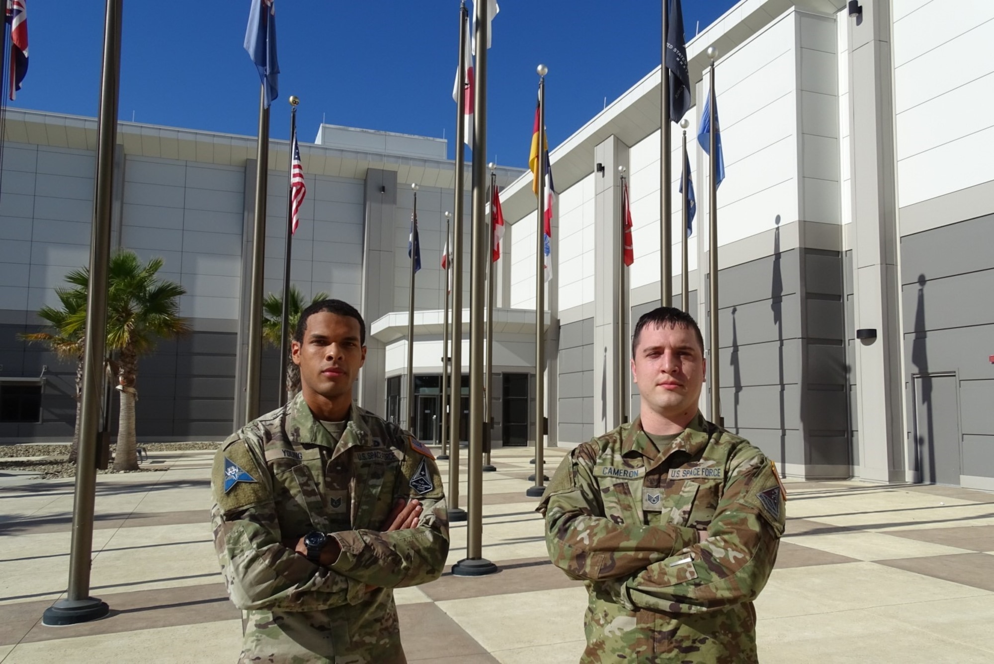 Two Space Force guardians standing outside HQ building