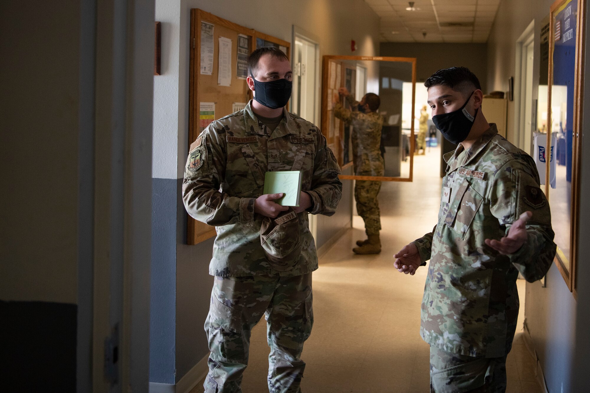 U.S. Air Force Staff Sgt. Kurtis Vandevender, a 1st Special Operations Wing occupational safety technician, discusses the yearly safety inspection with U.S. Air Force Senior Airman David Rodriguez, a 1st Special Operations Support Squadron aircrew flight equipment craftsman, Feb. 15, 2022, at Hurlburt Field, Florida.