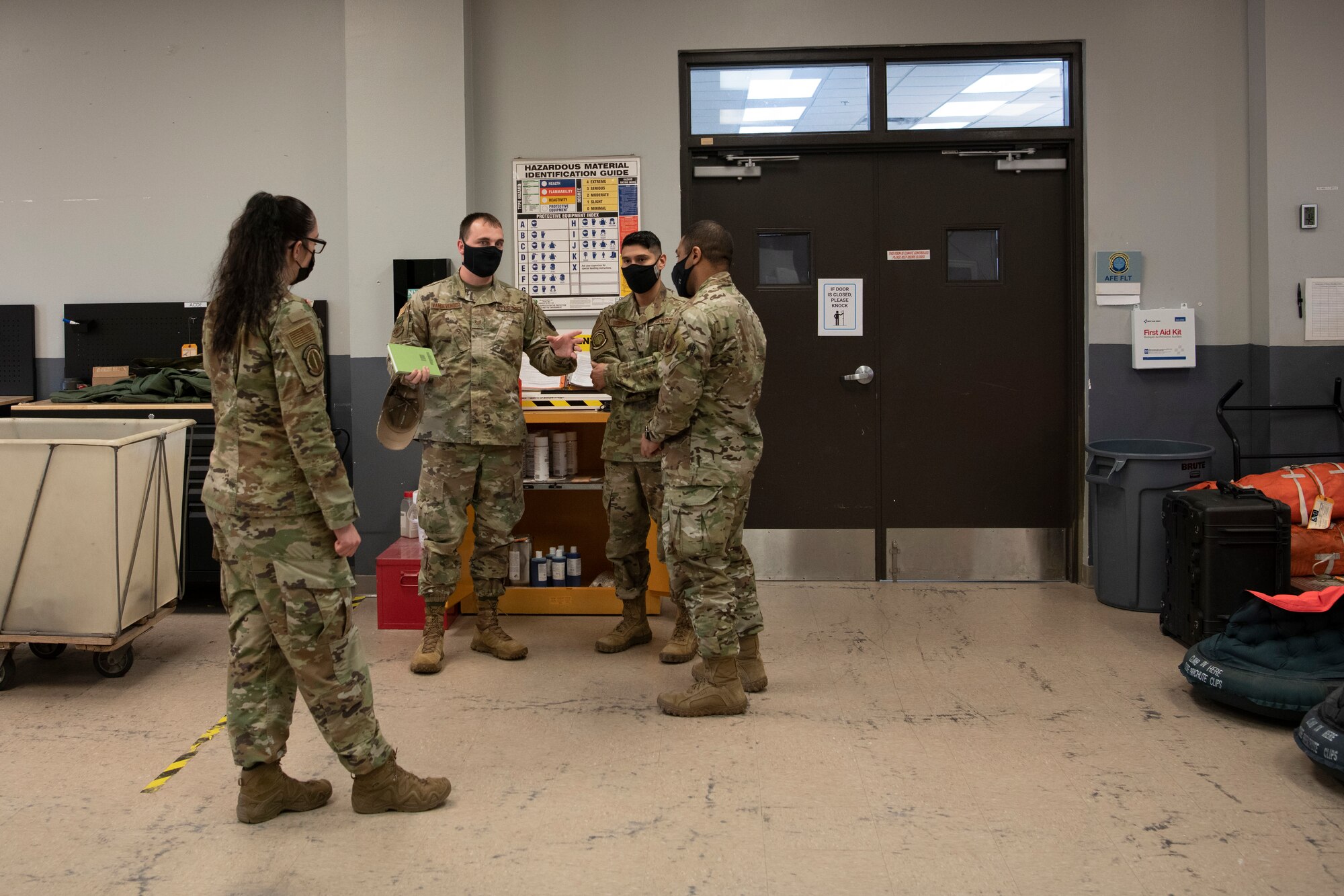 U.S. Air Force Staff Sgt. Kurtis Vandevender, a 1st Special Operations Wing occupational safety technician, discusses chemical safety with Airmen from the 1st Special Operations Support Squadron Feb. 15, 2022, at Hurlburt Field, Florida.