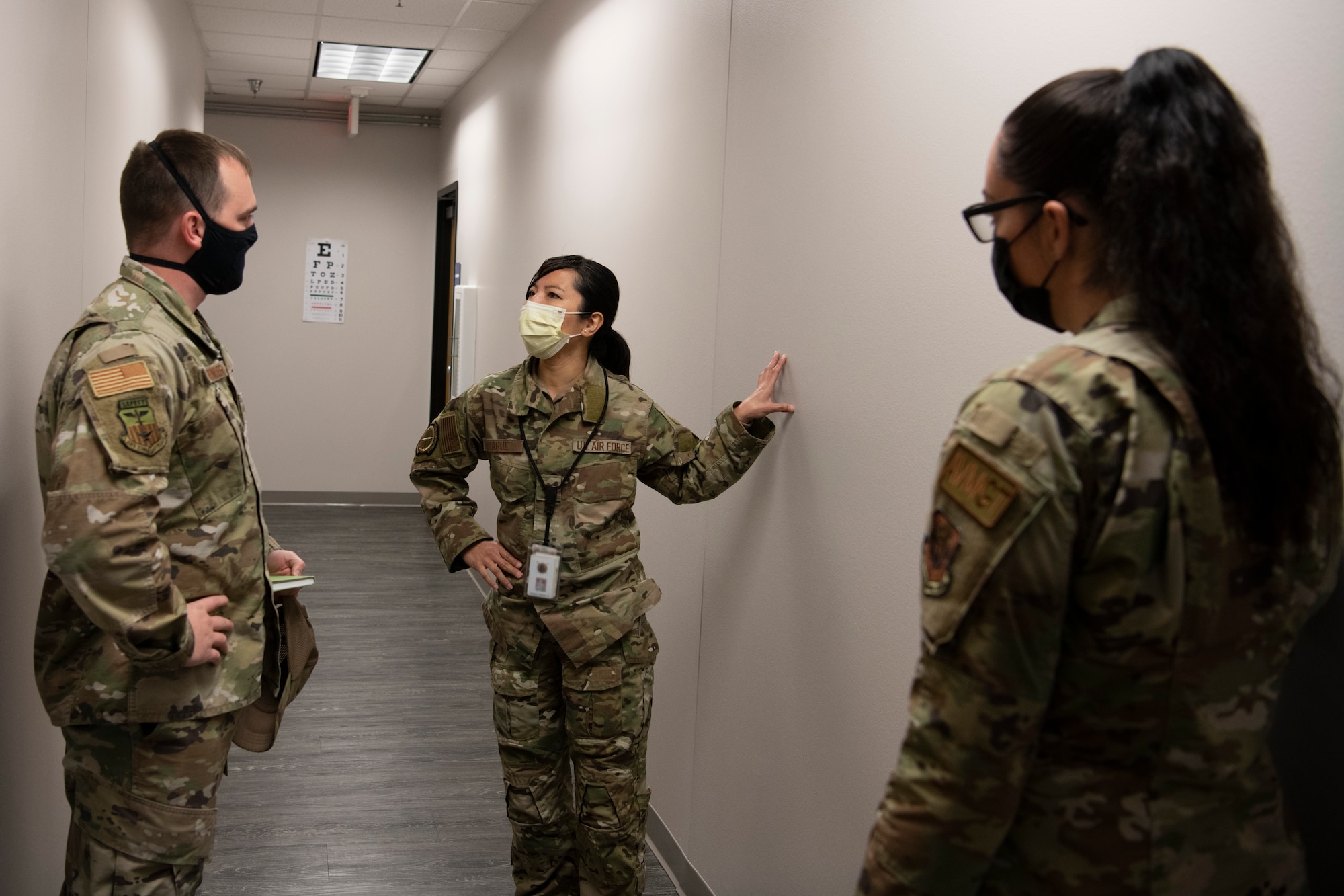 U.S. Air Force Staff Sgt. Kurtis Vandevender, a 1st Special Operations Wing occupational safety technician, left, and U.S. Air Force Staff Sgt. Sara Martinez, a 1st Special Operations Support Squadron unit safety representative, discuss clinic safety needs with U.S. Air Force Maj. Emmalyn Tague, 1st Special Operations Support Squadron clinic officer in charge of flight medicine during a safety inspection Feb. 15, 2022, at Hurlburt Field, Florida.