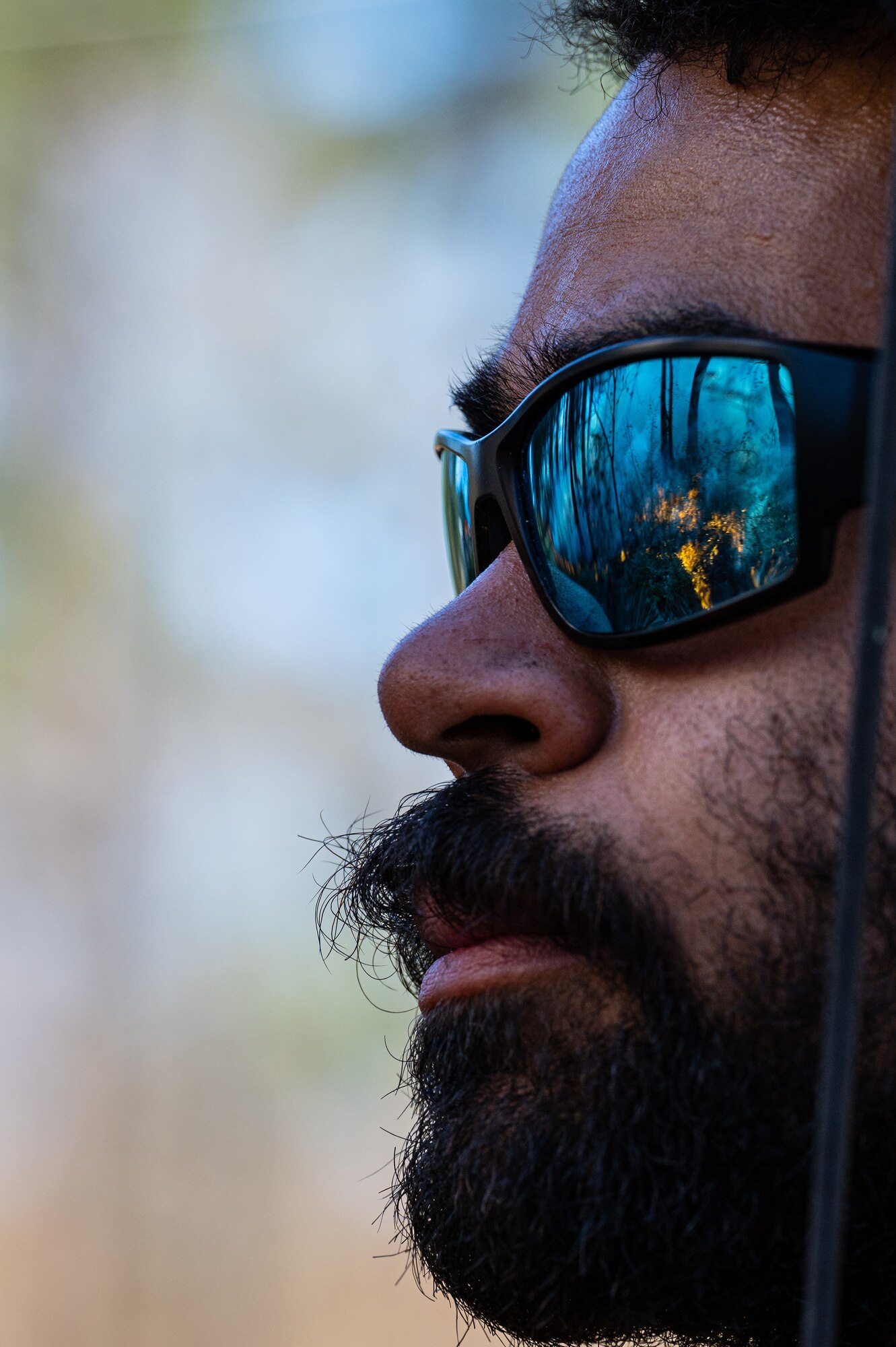 Melcolm Crutchfield, U.S. Fish and Wildlife seasonal firefighter, surveys the area during a controlled burn at Barksdale Air Force Base, Louisiana, Jan. 28, 2022.