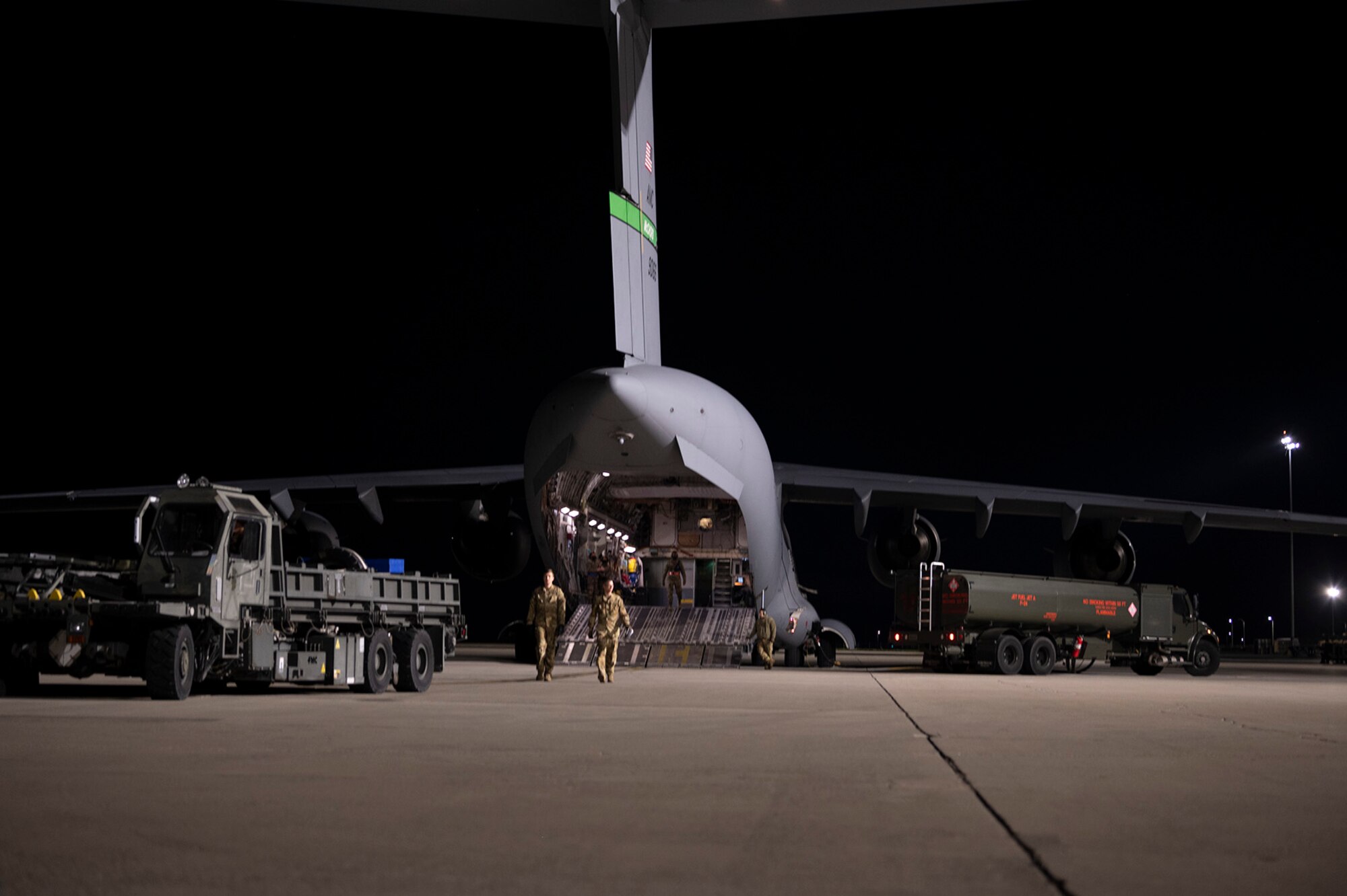 Airmen walk to a vehicle