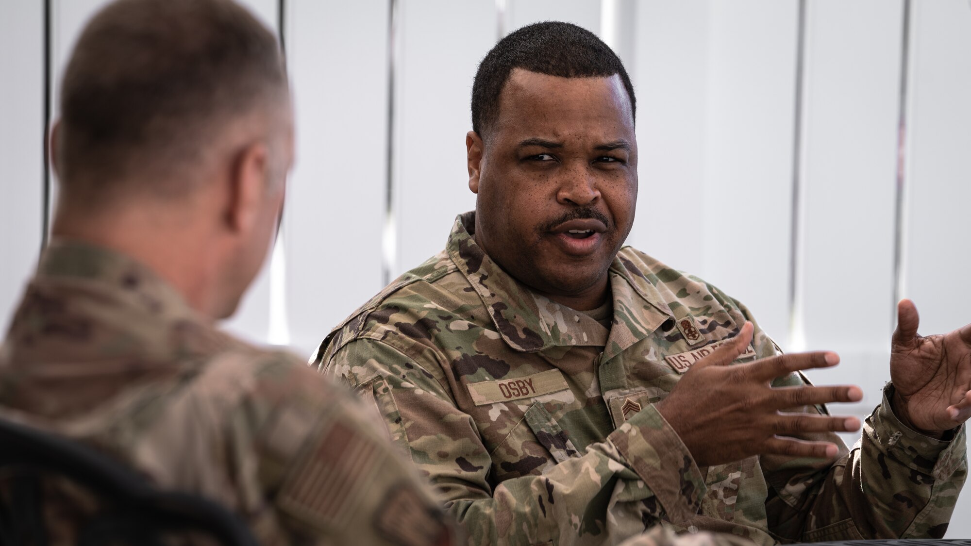U.S. Air Force Col. Jason Loschinskey, 6th Mission Support Group commander, and U.S. Air Force Chief Master Sgt. Kevin Osby, Army and Air Force Exchange Service’s senior enlisted advisor, discuss the vision of the Exchange at MacDill Air Force Base, Florida, Feb. 22, 2022.