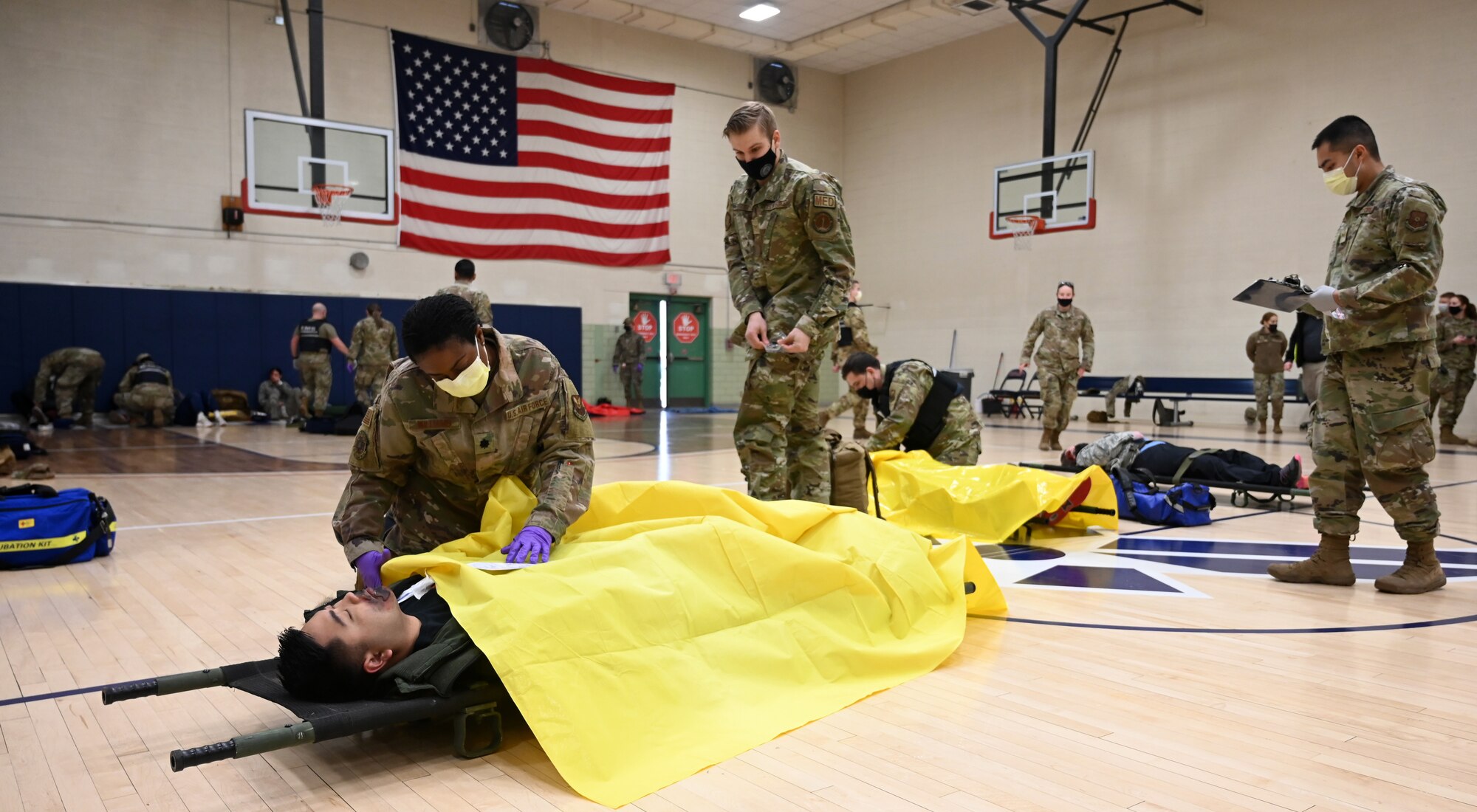 Medic performs triage to role player casualty