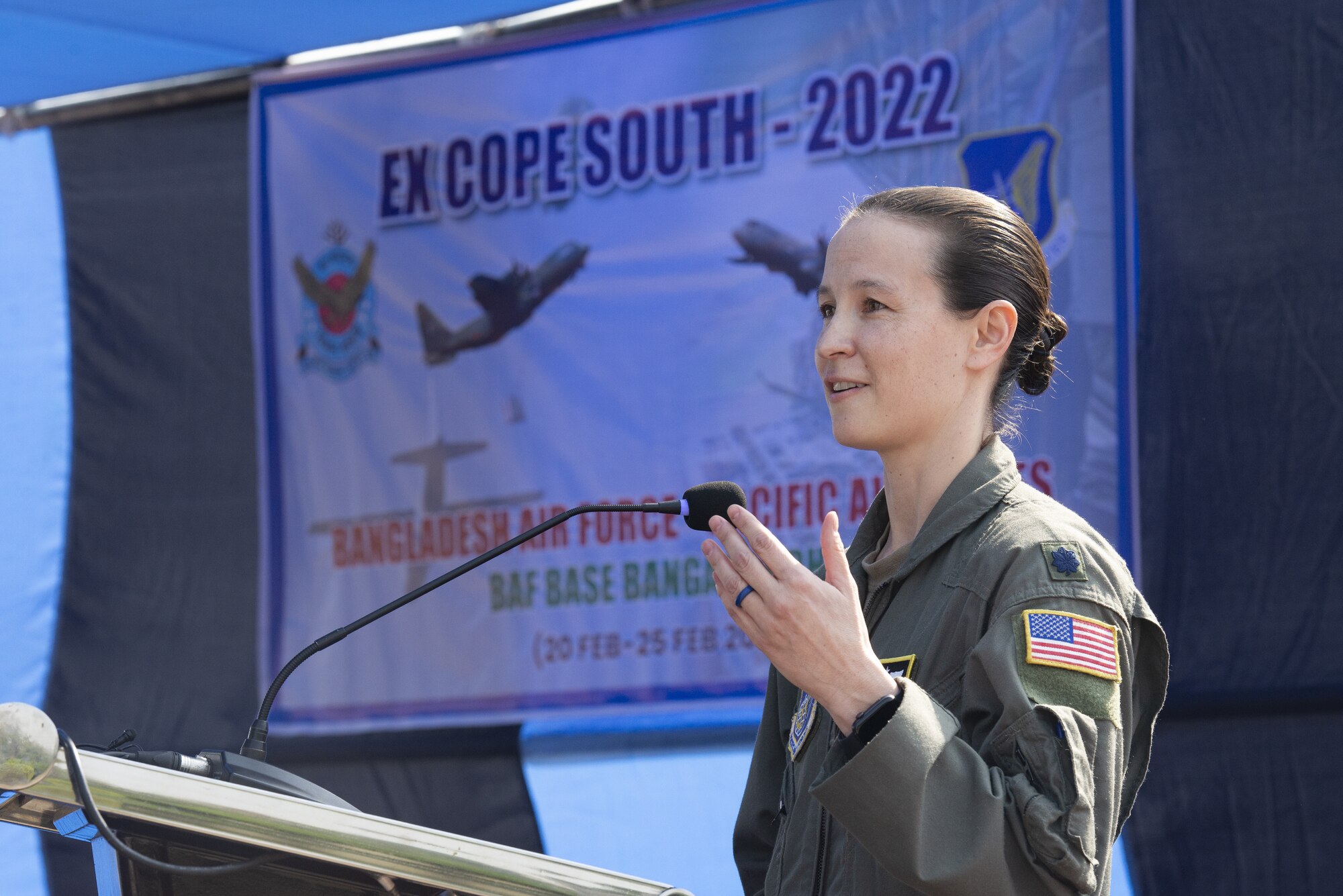 U.S. Air Force Lt. Col. Kira Coffey, 36th Expeditionary Airlift Squadron Commander, addresses the importance of the partnership between the U.S. Air Force and Bangladesh Air Force (BAF) to participants of Exercise Cope South 2022 during the exercise’s opening ceremony Feb. 19, 2022, at BAF Base Bangabandhu, Bangladesh.