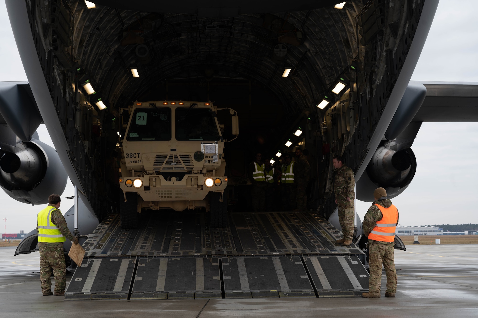 An Army vehicle drives out of a C-17 Globemaster III.