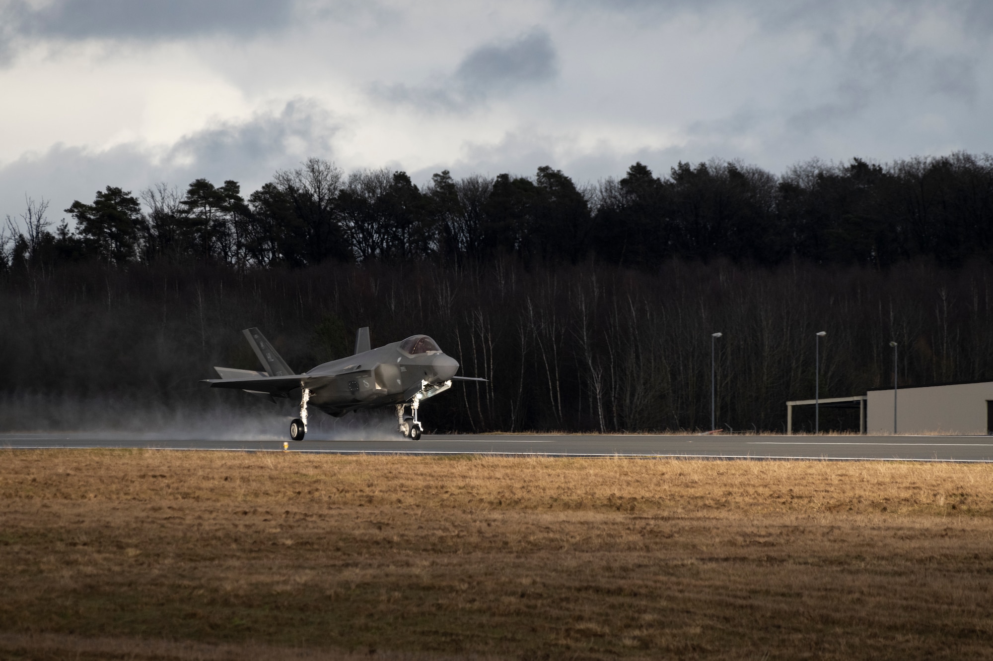 A U.S. Air Force F-35A Lightning II from the 34th Fighter Squadron at Hill Air Force Base, Utah, lands on the runway at Spangdahlem Air Base, Germany, Feb. 16, 2022, to increase NATO’s collective defense posture and enhance the capabilities of regional partners and allies.
