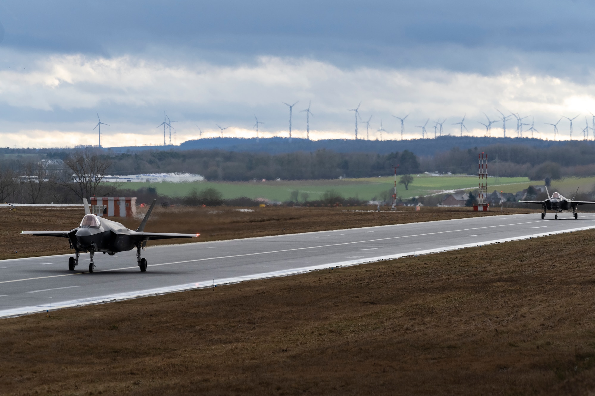 Two U.S. Air Force F-35A Lightning IIs from the 34th Fighter Squadron at Hill Air Force Base, Utah, taxi after landing at Spangdahlem Air Base, Germany, Feb. 16, 2022, to increase NATO’s collective defense posture and enhance the capabilities of regional partners and allies.