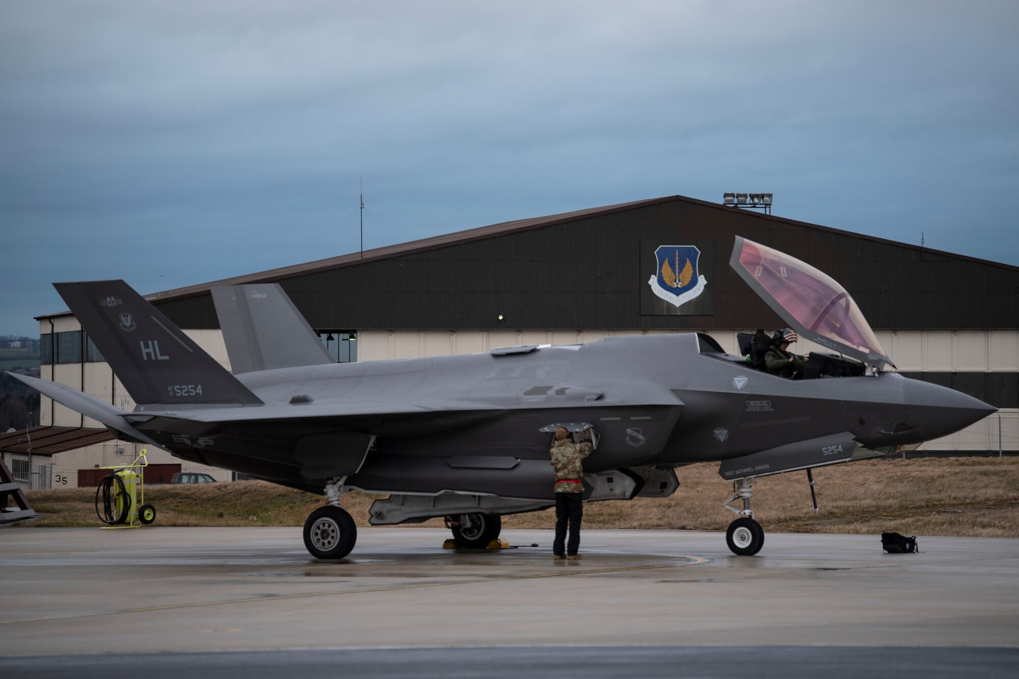 A U.S. Air Force aircraft maintainer performs post-flight checks on a U.S. Air Force F-35 Lightning II from the 34th Fighter Squadron at Hill Air Force Base, Utah, after the jet landed at Spangdahlem Air Base, Germany, Feb. 16, 2022.