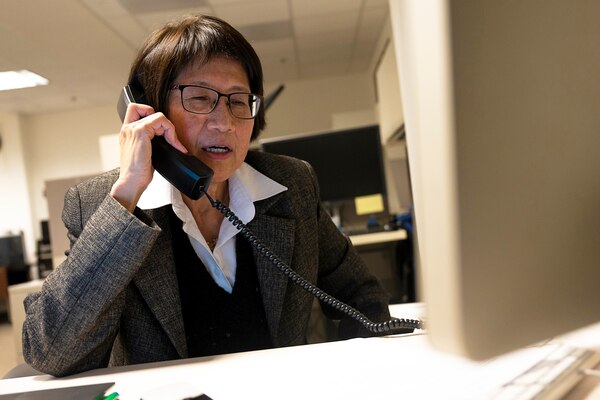 A woman talks on the phone.