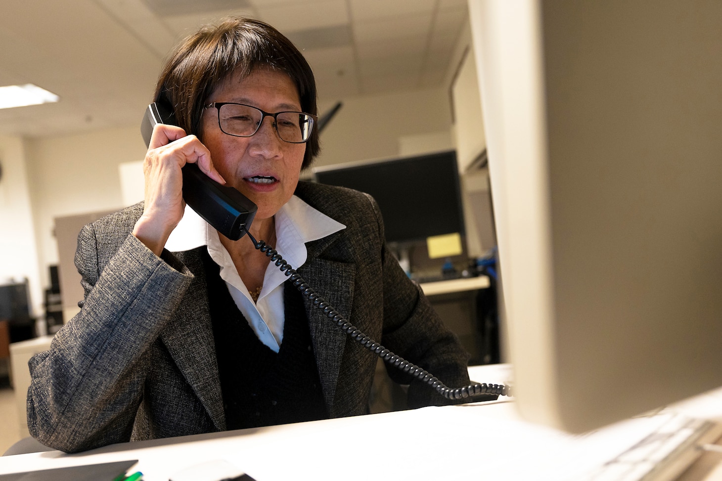 A woman talks on the phone.