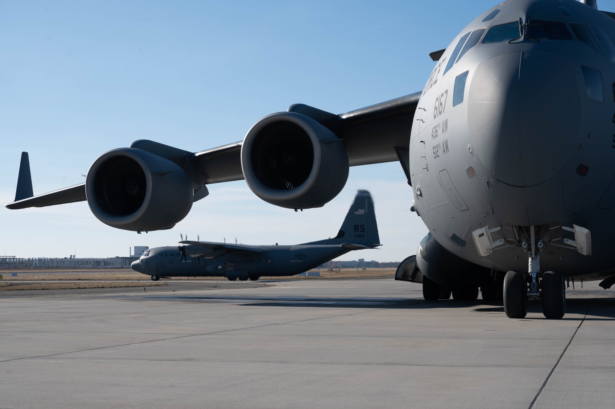 A  C-130J Super Hercules aircraft taxis onto the runway.