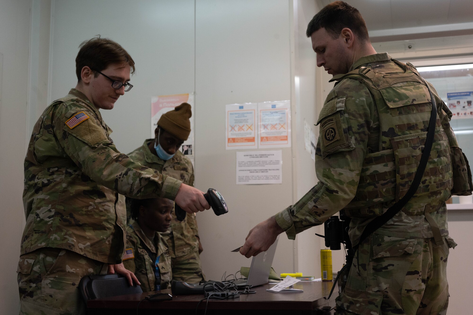 A U.S. Army soldier scans an ID card.