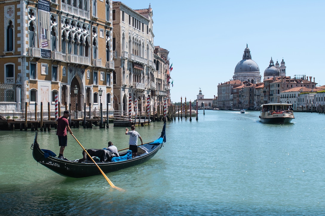 Young gondoliers training on an empty Grand Canal just after the reopening after the lockdown for COVID-19. Venice,
Italy (Photo by: Simone Padovani at Shutterstock ID: 1744194650. May 2020)