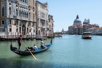 Young gondoliers training on an empty Grand Canal just after the reopening after the lockdown for COVID-19. Venice,
Italy (Photo by: Simone Padovani at Shutterstock ID: 1744194650. May 2020)