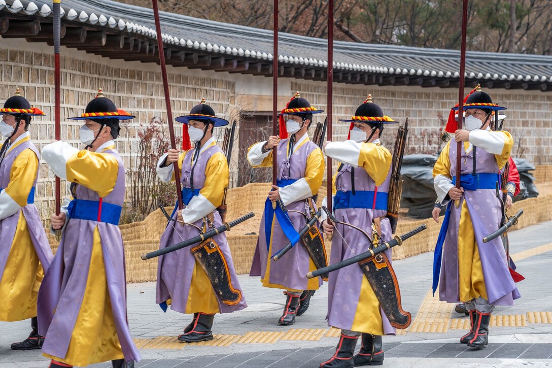 Royal guards at Deoksugung Palace wearing face masks to protect against infection from the Coronavirus Covid-19. Seoul,
South Korea. (Photo by: bmszealand at Shutterstock ID: 1659561283. January 31, 2020)