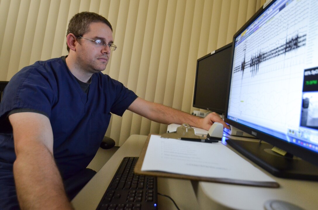 Christopher Taylor, a sleep technician with Madigan Army Medical Center, calibrates sensors during a sleep study at Joint Base Lewis-McChord, Wash., Nov. 22, 2013