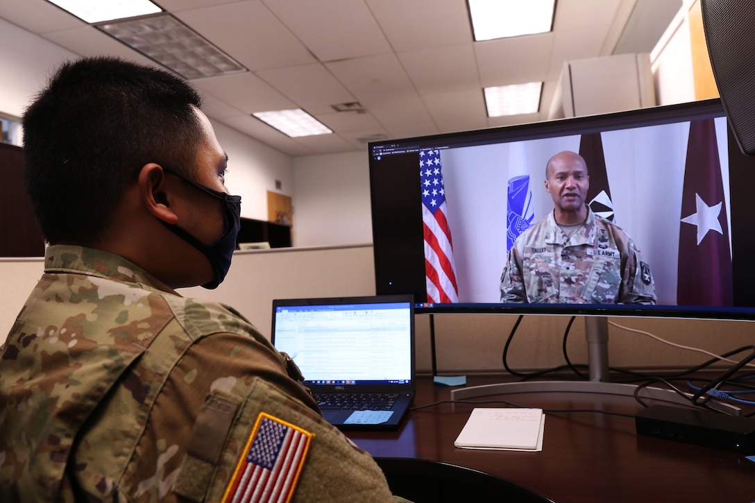 Spc. Jaesarr De Guzman, Walter Reed Army Institute of Research, behavioral health specialist, views the pre-recorded Asian American and Pacific Islander Heritage Month celebration video, May 20, 2021