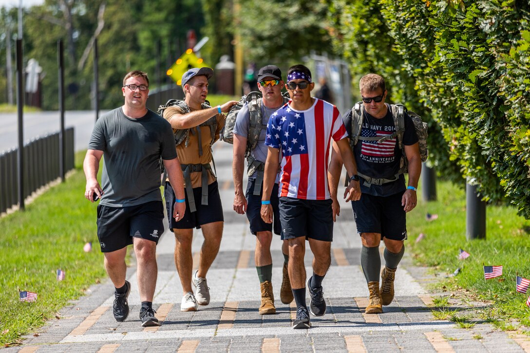 Members from Walter Reed Army Institute of Research continue walk and ruck along the course during the 9/11 Remembrance Miles event at Forest Glen Annex, Sept. 10, 2021