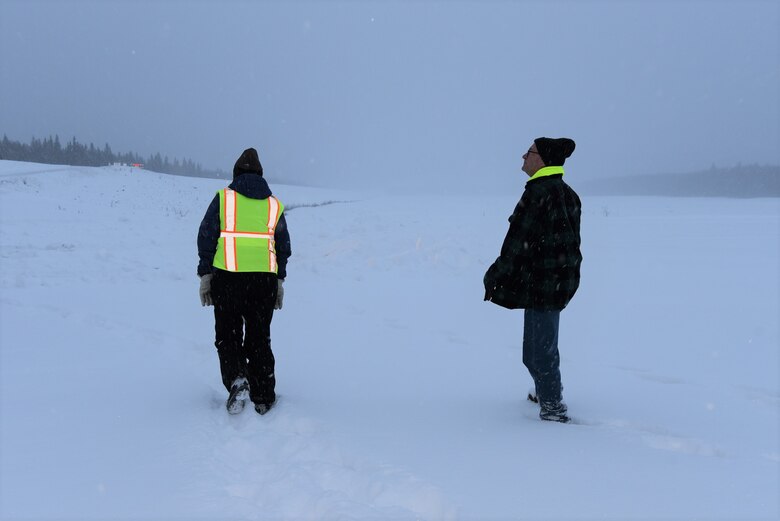 Julie Anderson (left), chief of the Operations Branch for the U.S. Army Corps of Engineers – Alaska District; and Brad Olson, asset management specialist; assess snow conditions on Dec. 7 near the Moose Creek Dam at the Chena River Lakes Flood Control Project in North Pole, Alaska.