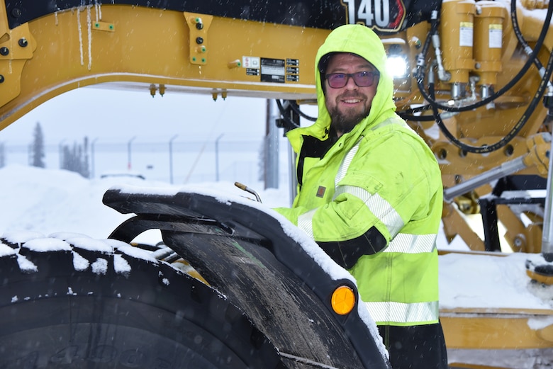 Ryan Lucke, engineering equipment operator for the U.S. Army Corps of Engineers – Alaska District, defrosts a grader on Dec. 7 at the Chena River Lakes Flood Control Project in North Pole, Alaska.