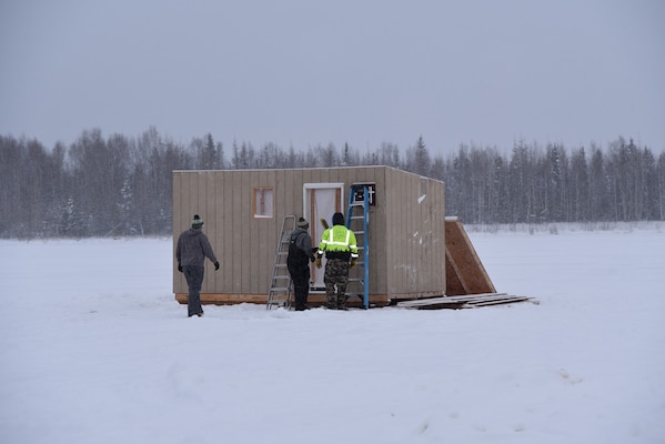 Recreators construct an ice fishing hut on Dec. 7 at the Chena River Lakes Flood Control Project in North Pole, Alaska.