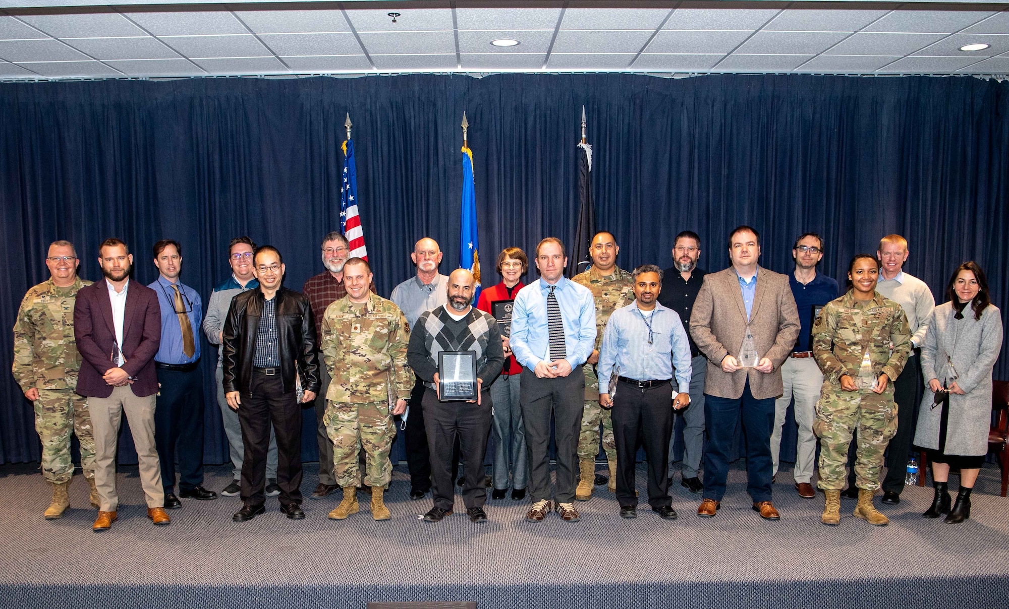 Col. Eric Felt (2nd row on left), director of the AFRL Space Vehicles Directorate, with many of the individual and team award recipients at the directorate’s 2021 Annual Awards ceremony held at Kirtland AFB, N.M. February 9. (U.S. Air Force photo/Allen Winston)