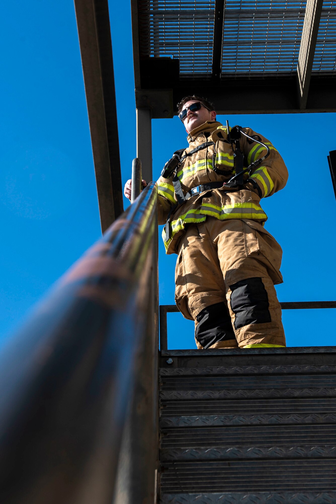 Tech. Sgt. Parker Bass, 4th Civil Engineering Squadron station captain, rests after a fire training exercise at Seymour Johnson Air Force Base, North Carolina, Feb. 10, 2022. The exercise was created by intentionally starting a fire in the second story of a building to improve Airmen’s skills in possible real world scenarios. (U.S. Air Force photo by Airman 1st Class Sabrina Fuller)