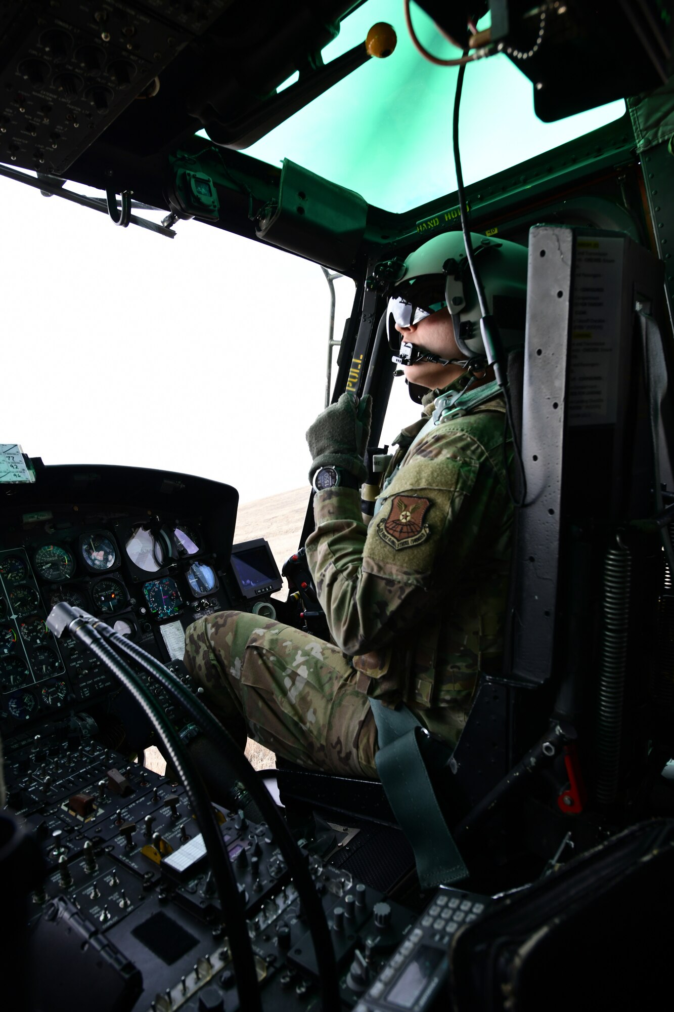 Capt. Nicole Poupart, 37th Helicopter Squadron pilot, flies the UH-1N Huey February 15, 2022 over Wyoming and Colorado. The 37 HS helps the 90th Missile Wing by providing aerial protection to its Airmen and mission. (U.S. Air Force photon by Airman Sarah Post)