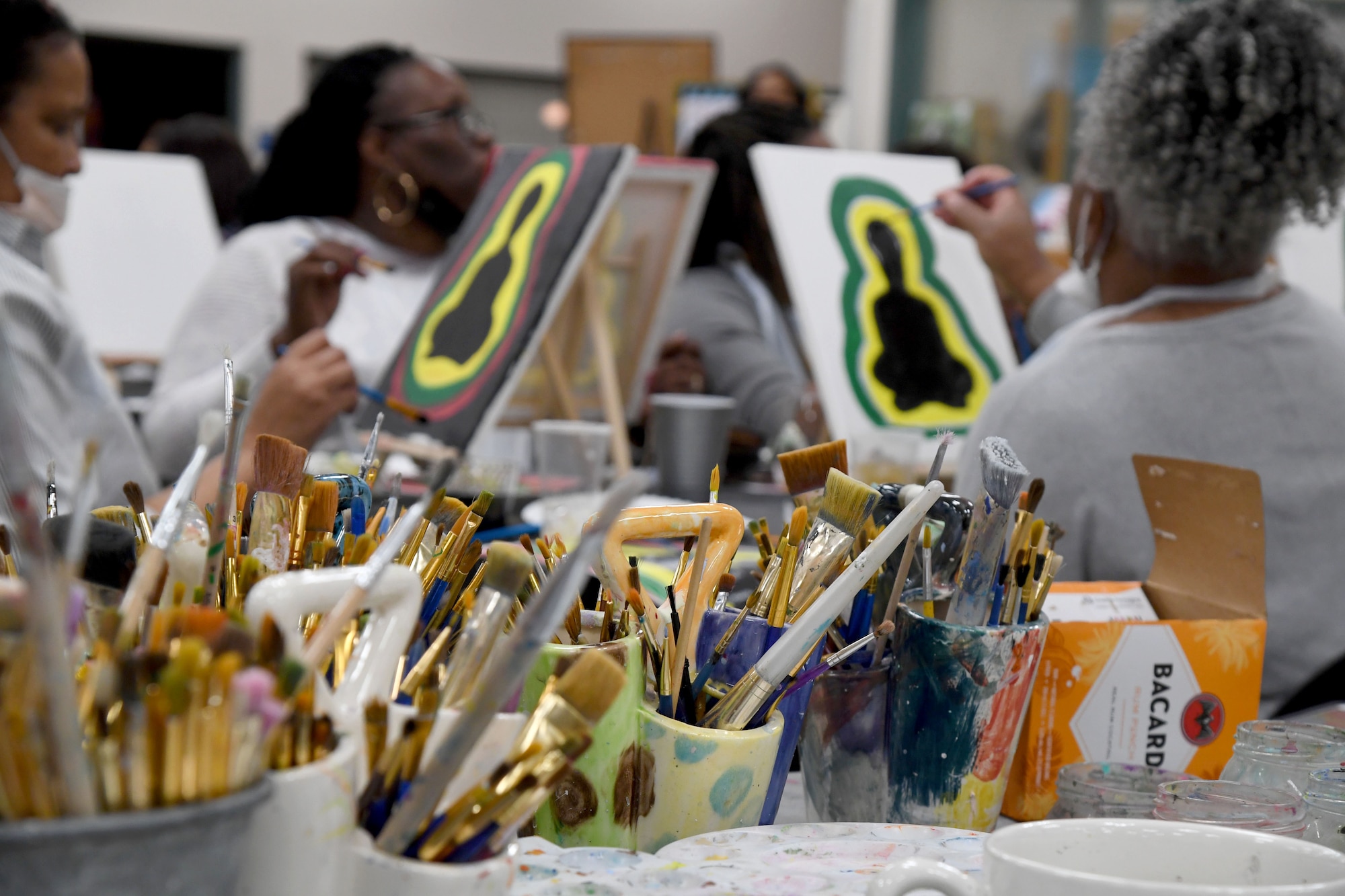 Keesler personnel participate in a paint and sip event inside the Keesler Arts and Crafts Center at Keesler Air Force Base, Mississippi, Feb. 18, 2022. The African-American Heritage and Black History Month Committees hosted the event in celebration of Black History Month, which is celebrated throughout February. (U.S. Air Force photo by Kemberly Groue)