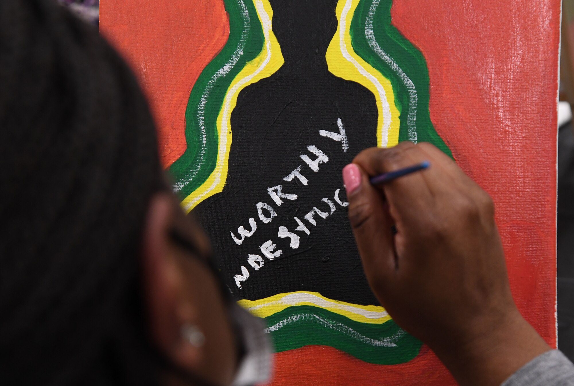 U.S. Air Force Maj. Kimberly Bertrand, 81st Medical Group program director, participates in a paint and sip event inside the Keesler Arts and Crafts Center at Keesler Air Force Base, Mississippi, Feb. 18, 2022. The African-American Heritage and Black History Month Committees hosted the event in celebration of Black History Month, which is celebrated throughout February. (U.S. Air Force photo by Kemberly Groue)