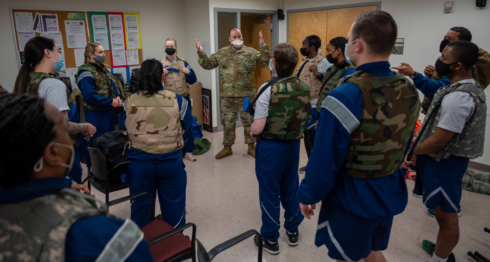 Tech. Sgt. Brock Ashbaugh, 436th Medical Group Tactical Combat Casualty Care instructor, prepares Airmen for an exercise during a TCCC class at Dover Air Force Base, Delaware, Feb. 18, 2022. Held by the 436th MDG, this is the second TCCC Combat LifeSaver course for medical Airmen who are not frontline responders. During TCCC CLS, Airmen are taught life-saving skills and tested during a rigorous cap-stone exercise. (U.S. Air Force photo by Senior Airman Faith Schaefer)