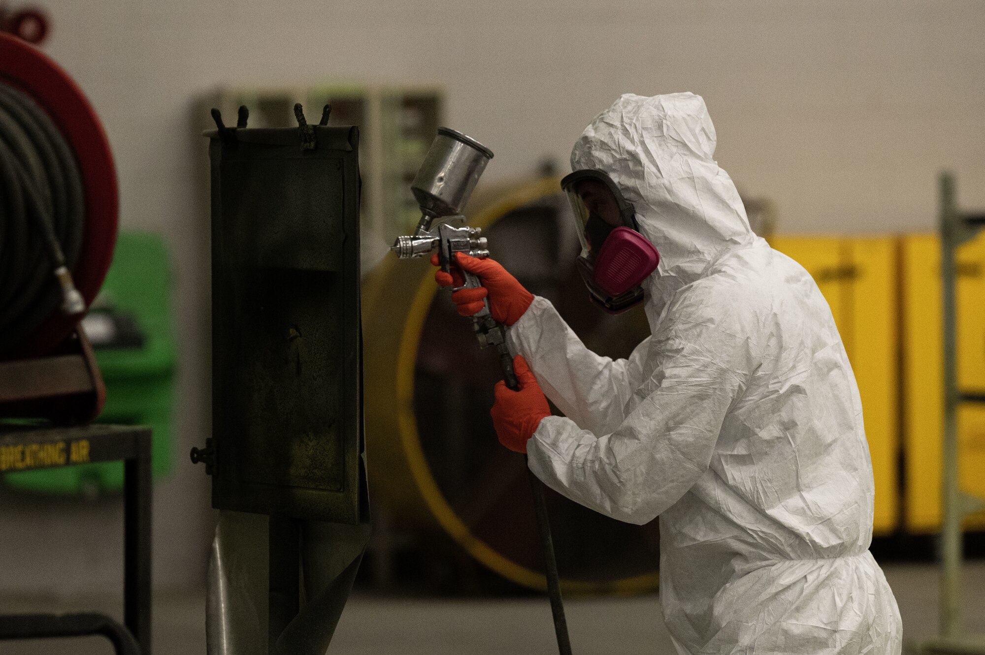 U.S. Air Force Staff Sgt. Dorian Whippie, a 1st Special Operations Maintenance Squadron aircraft structural maintenance craftsman, tests a paint gun for proper function in the corrosive control shop at Hurlburt Field, Florida, Feb. 16, 2022.