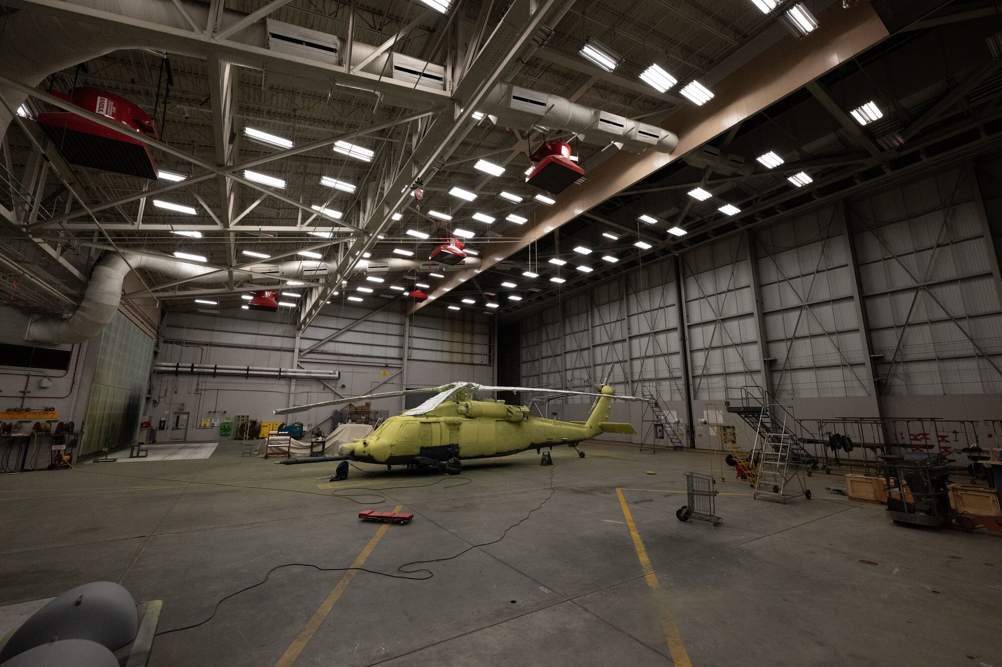 An MH-60G Pave Hawk Helicopter waits to be primed and painted in the 1st Special Operations Maintenance Squadron corrosion control shop at Hurlburt Field, Florida, Feb. 16, 2022.