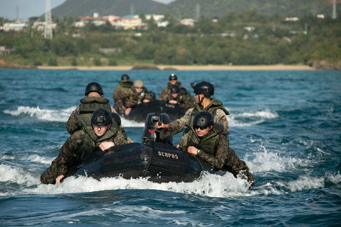 U.S. Marines with Motor Transportation Company, Combat Logistics Battalion 4, Combat Logistics Regiment 3, 3d Marine Logistics Group, conduct amphibious resupply operations aboard Combat Rubber Raiding Craft for Jungle Warfare Exercise 22, Okinawa, Japan, Feb. 15, 2022. JWX 22 is a large-scale field training exercise focused on leveraging the integrated capabilities of joint and allied partners to strengthen all-domain awareness, maneuver, and fires across a distributed maritime environment. (U.S. Marine Corps video by Lance Cpl. Madison Santamaria)