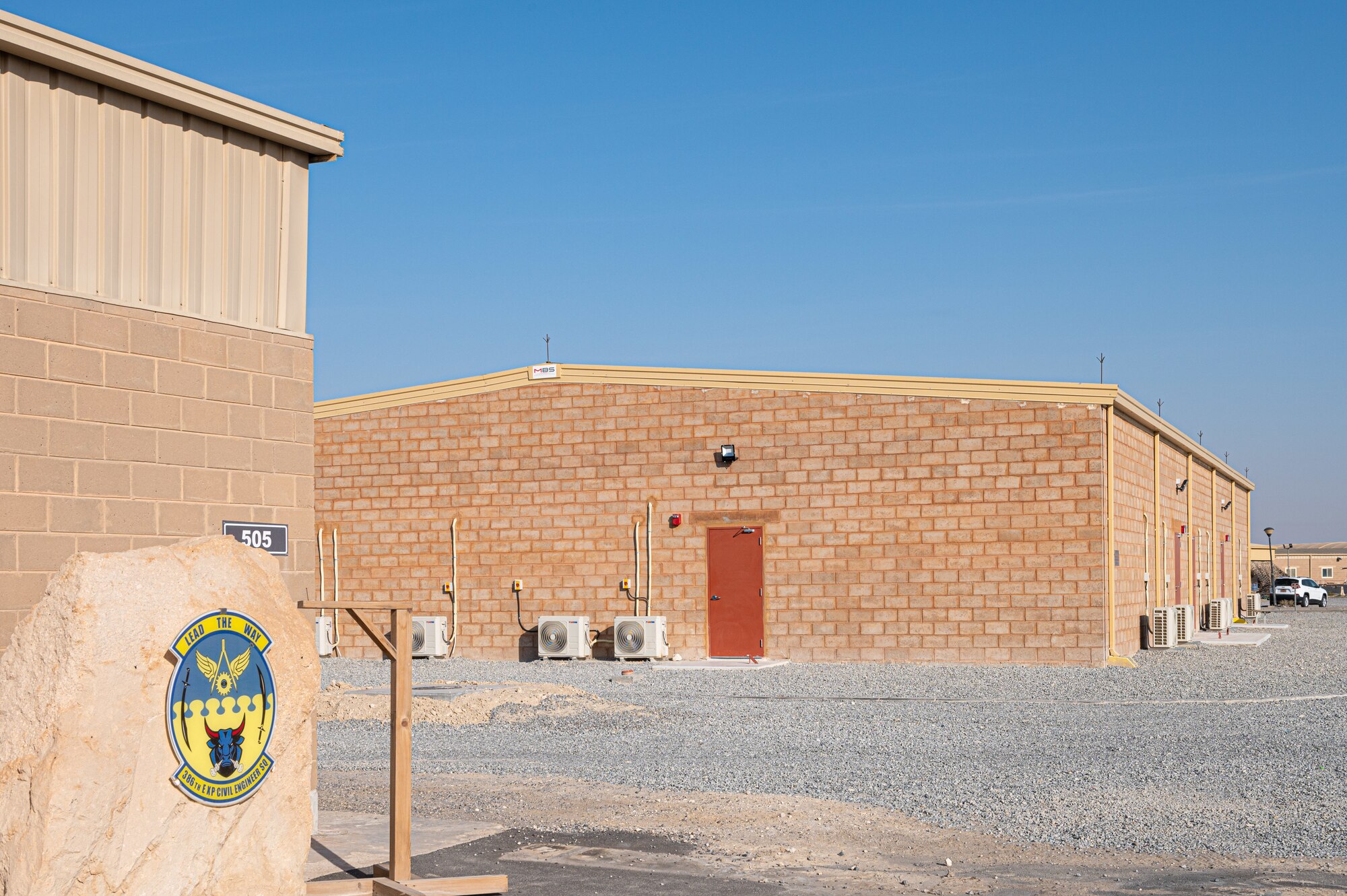 A new building was completed at Ali Al Salem Air Base recently. This one is a bit different from the rest that stand around it, with its red tinted brick that stretches to its roof. Using local building practices as well as material, this building is a first of its kind which might lead to a new engineering mindset for the future of the base.