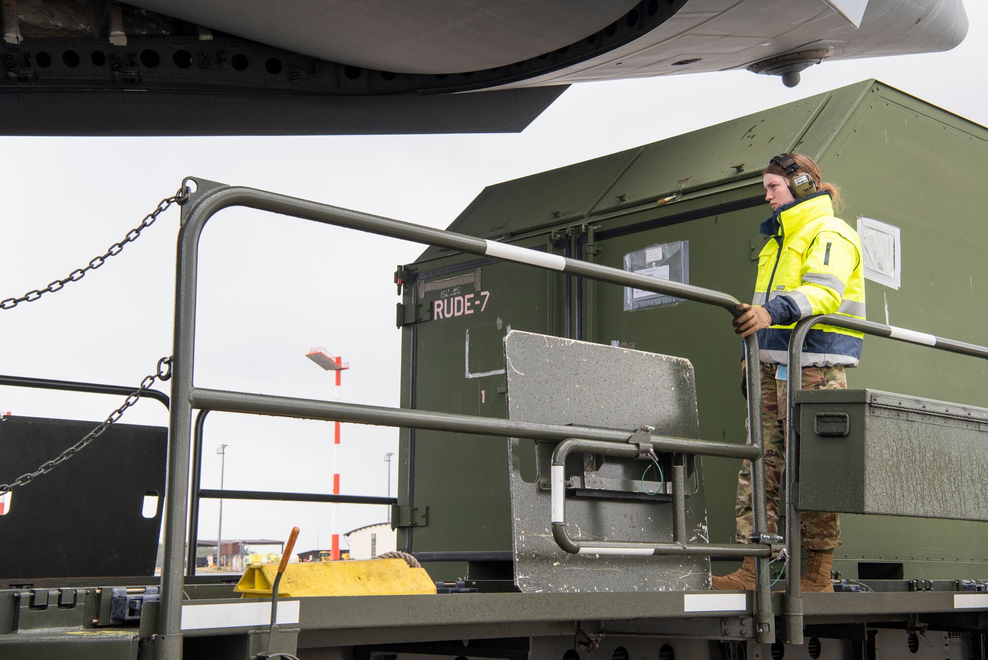 Airmen from the 726th Air Mobility squadron unload cargo from a C-17 Globemaster III aircraft.